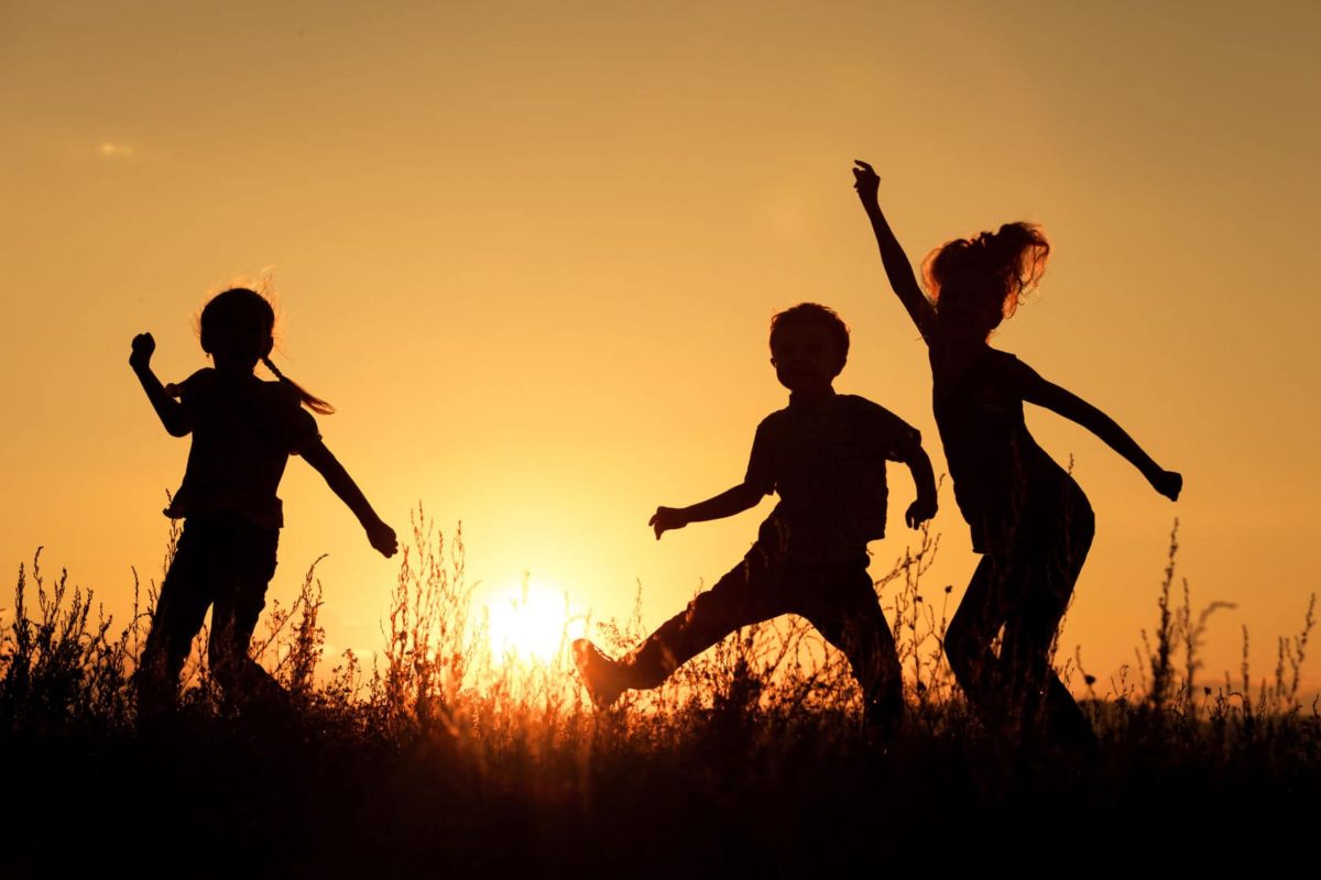 Children-playing-in-the-park-at-sunset-scaled